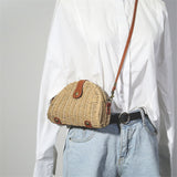 Beige semicircular straw shoulder bag for summer travel and beach style