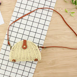 Beige semicircular straw shoulder bag for summer travel and beach style