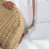 Beige semicircular straw shoulder bag for summer travel and beach style