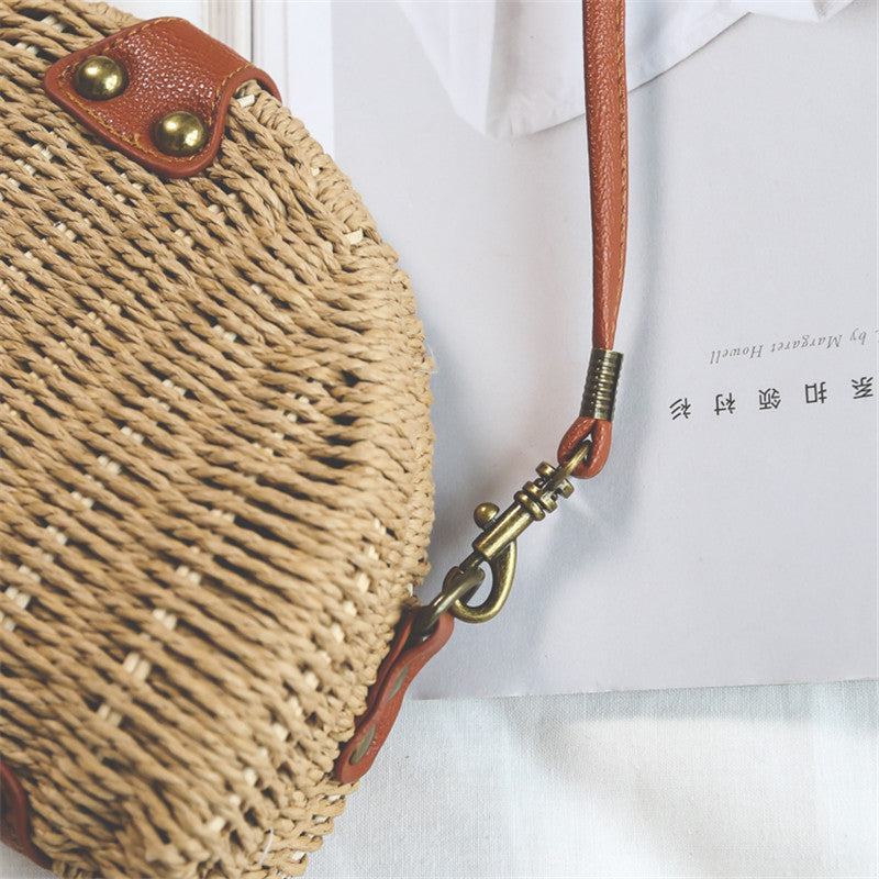 Beige semicircular straw shoulder bag for summer travel and beach style