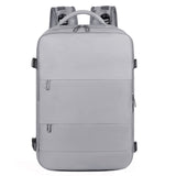 Grey multi-compartment backpack with water-resistant material and luggage strap – perfect for women on the go