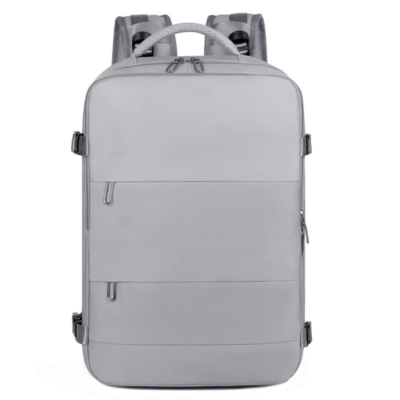 Grey multi-compartment backpack with water-resistant material and luggage strap – perfect for women on the go