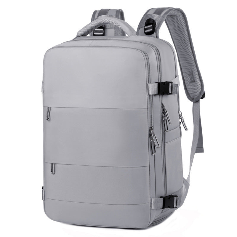 Grey multi-compartment backpack with water-resistant material and luggage strap – perfect for women on the go