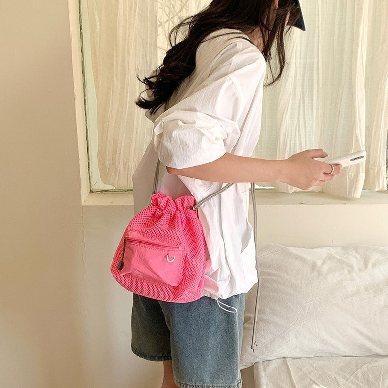 Pink lightweight mesh shoulder bag for holidays and casual outfits