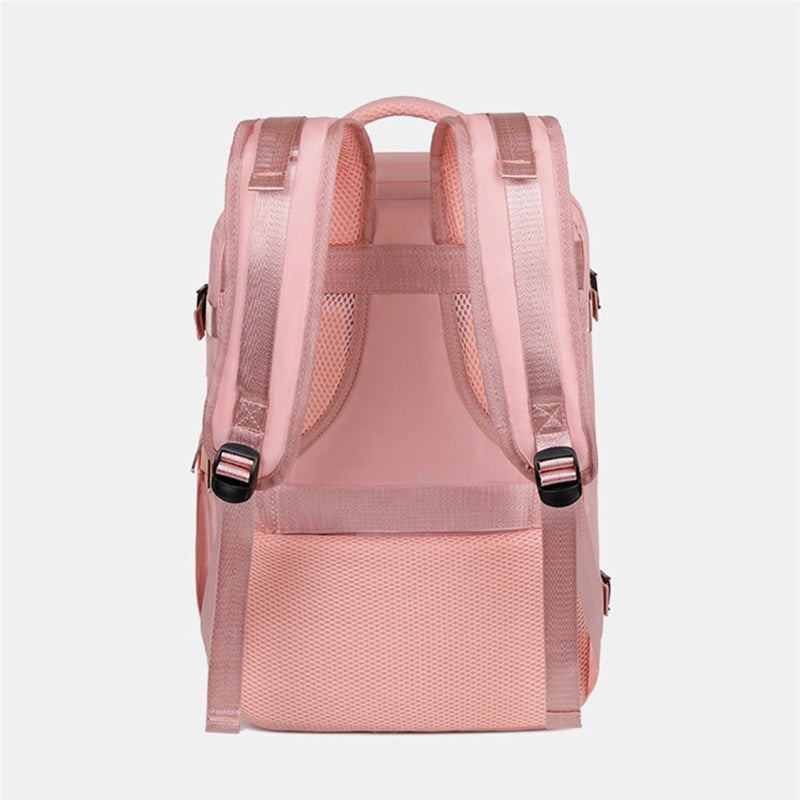 Pink women’s large capacity travel backpack with laptop sleeve and wet/dry compartments
